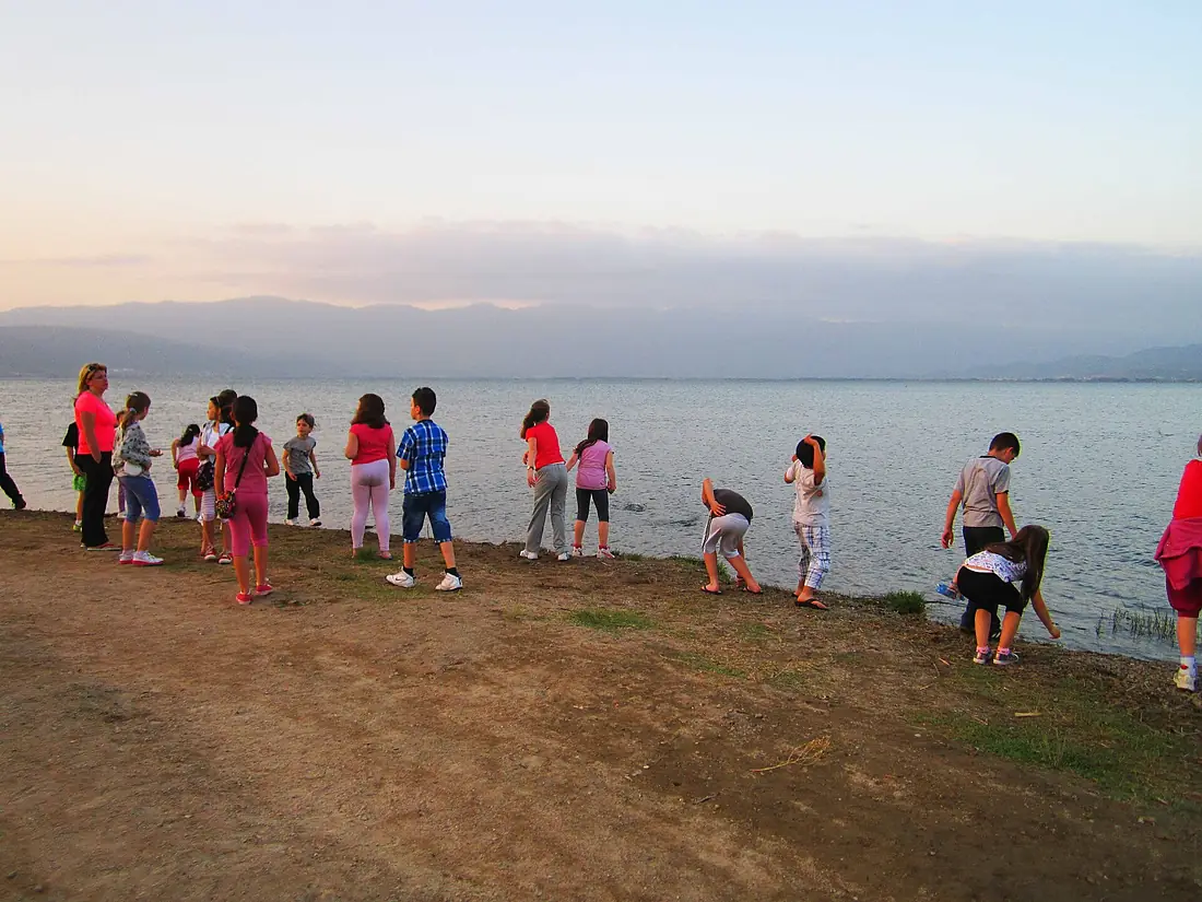 Children play beside Dojran lake