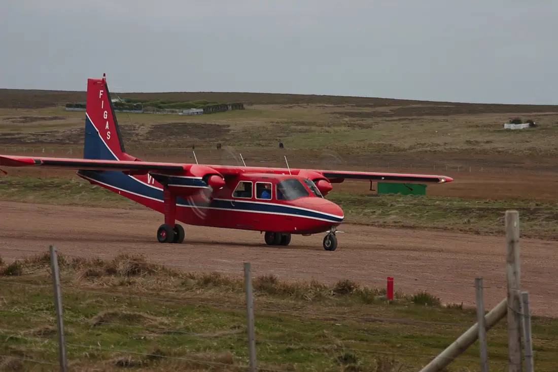 Britten-Norman Islander aircraft of the Falkland Islands Government Air Service (FIGAS) on the compacted gravel airstrip at Sea Lion Island, 2004